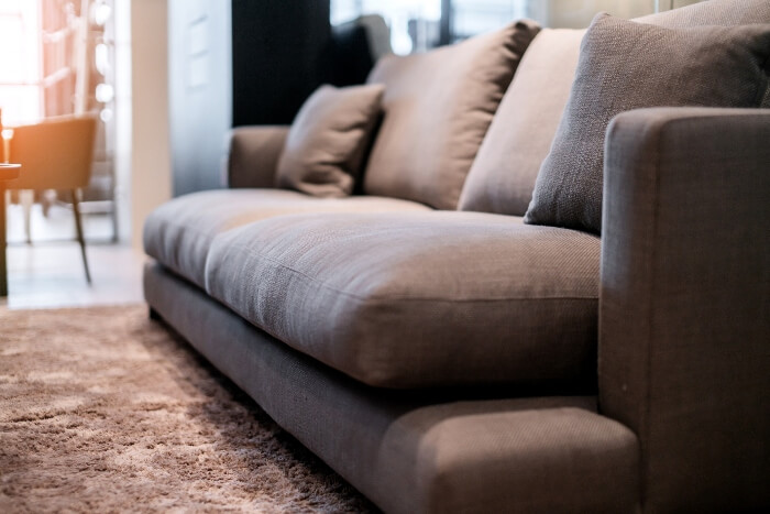 Sofa on a carpet of a modern living room – Mobler Modern Furniture