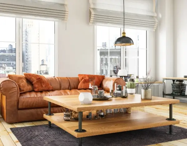 Stylish coffee table with accents, near a leather sofa in an upscale Edmonton apartment